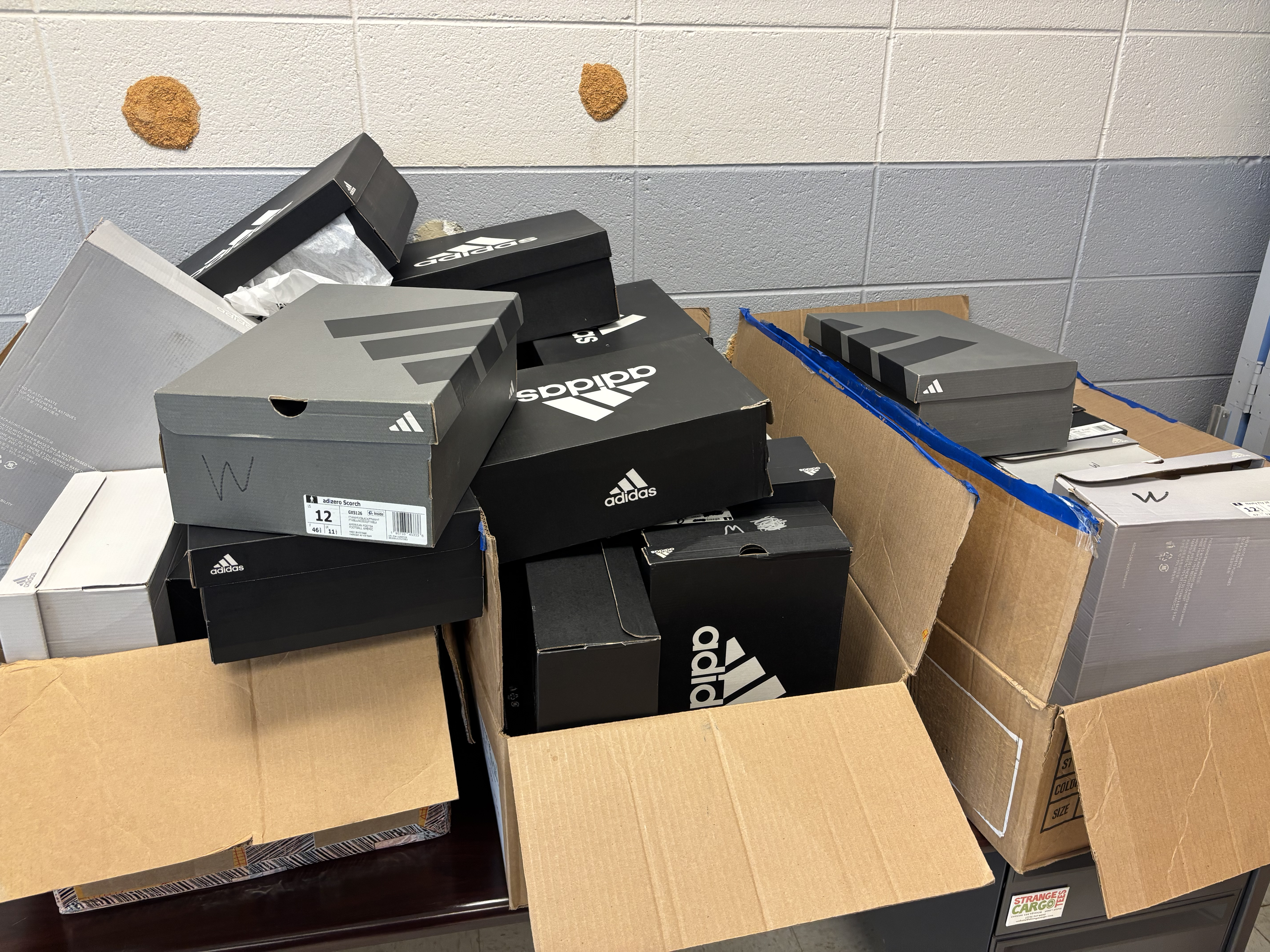 Box of Adidas cleats